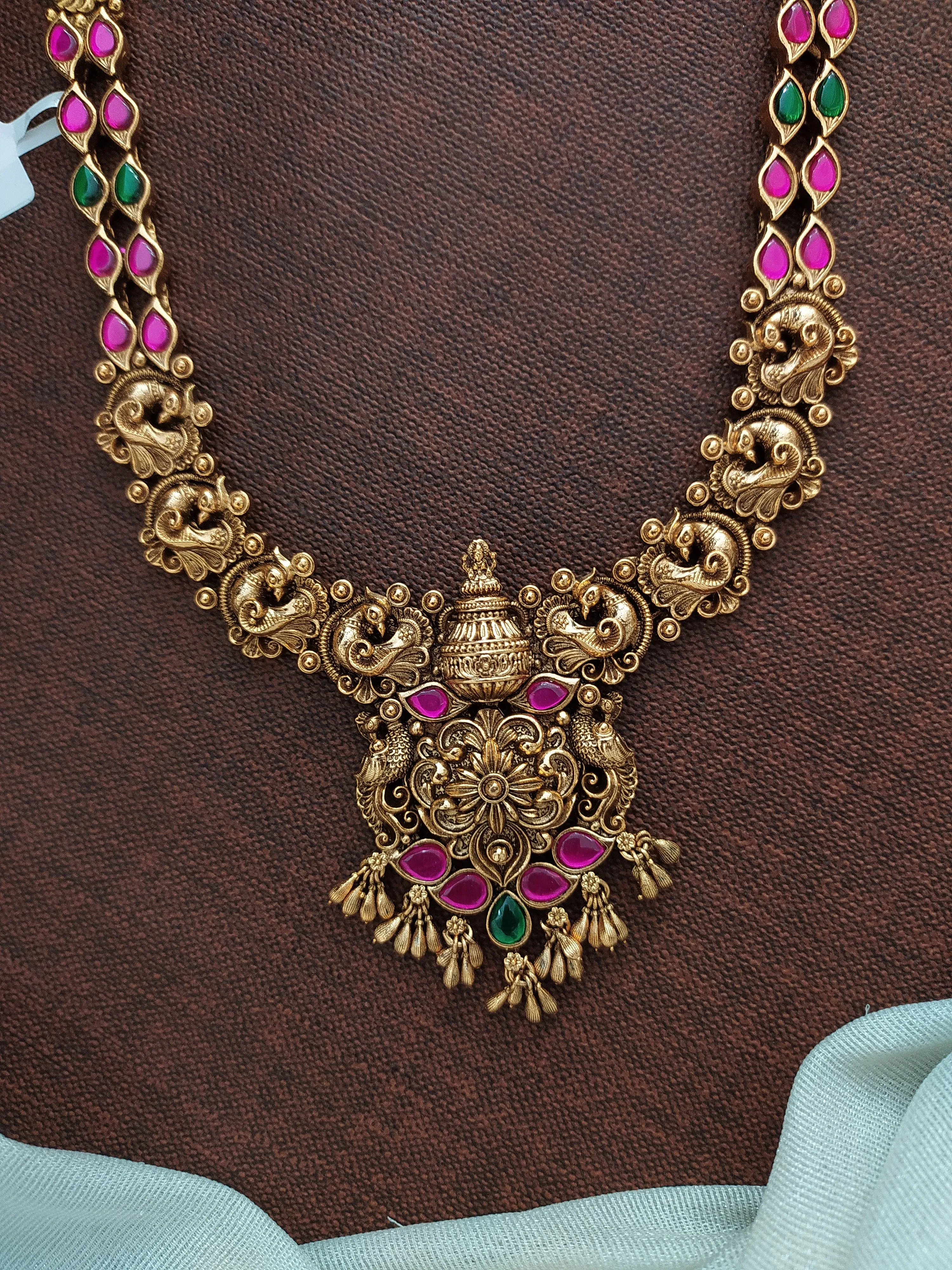 Antique Copperish Finish Long Haram Set with Nakshi & Jadau Kundan Work in Peacock Design