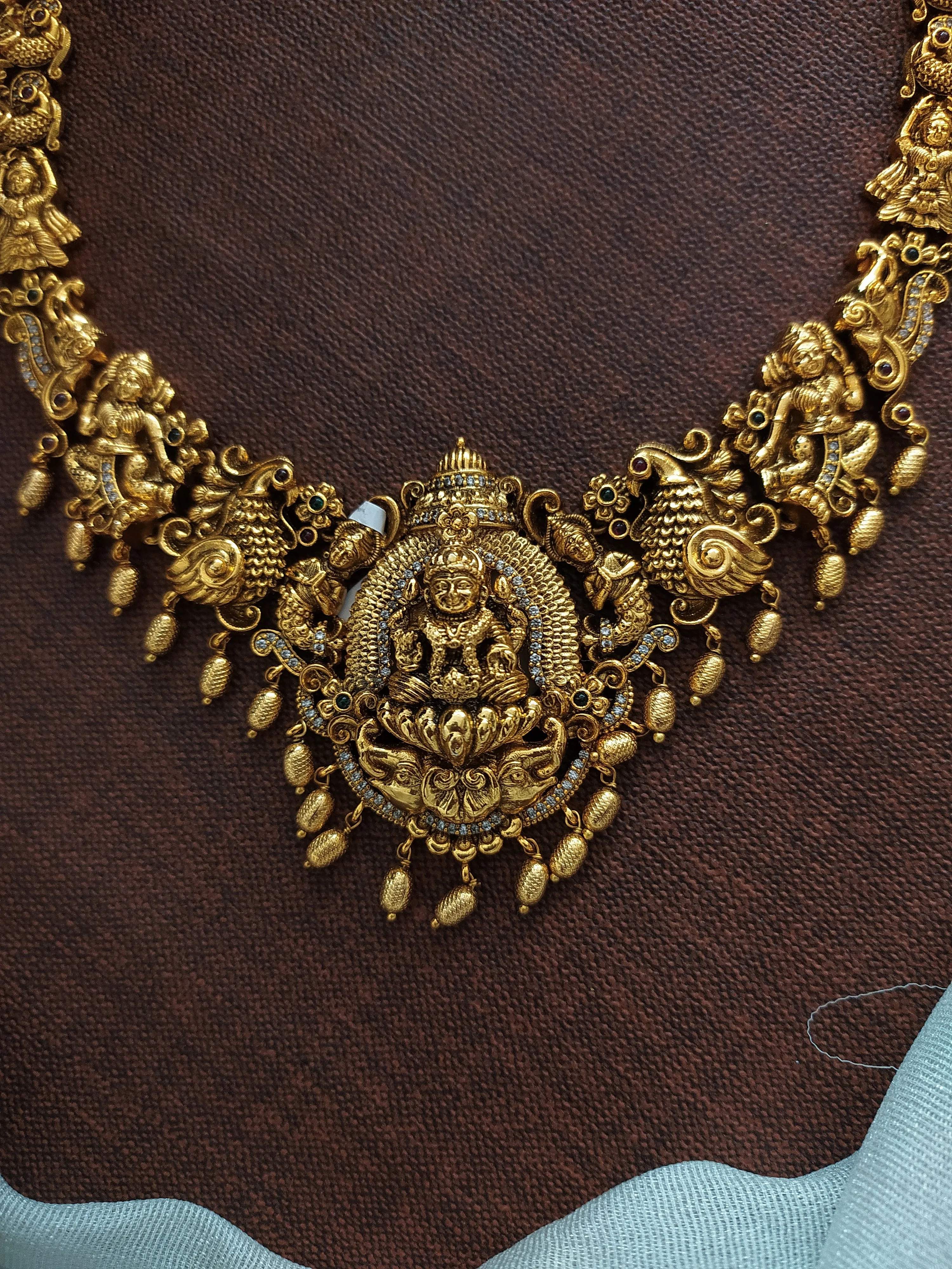 Antique Lakshmi Long Haram Set with Nagas Work and Zircon Stones