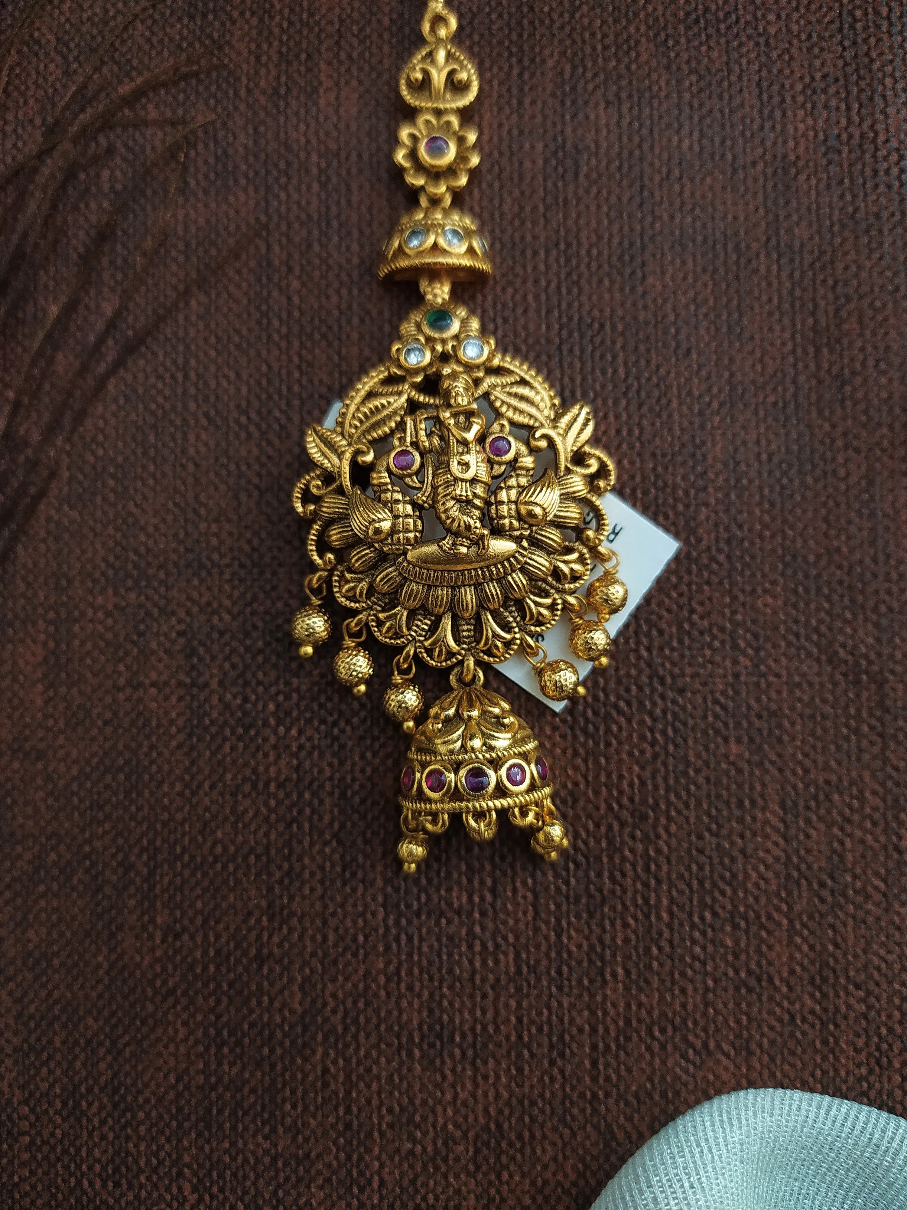 Antique Tikka Featuring Lord Krishna with Kemp and Green Stones