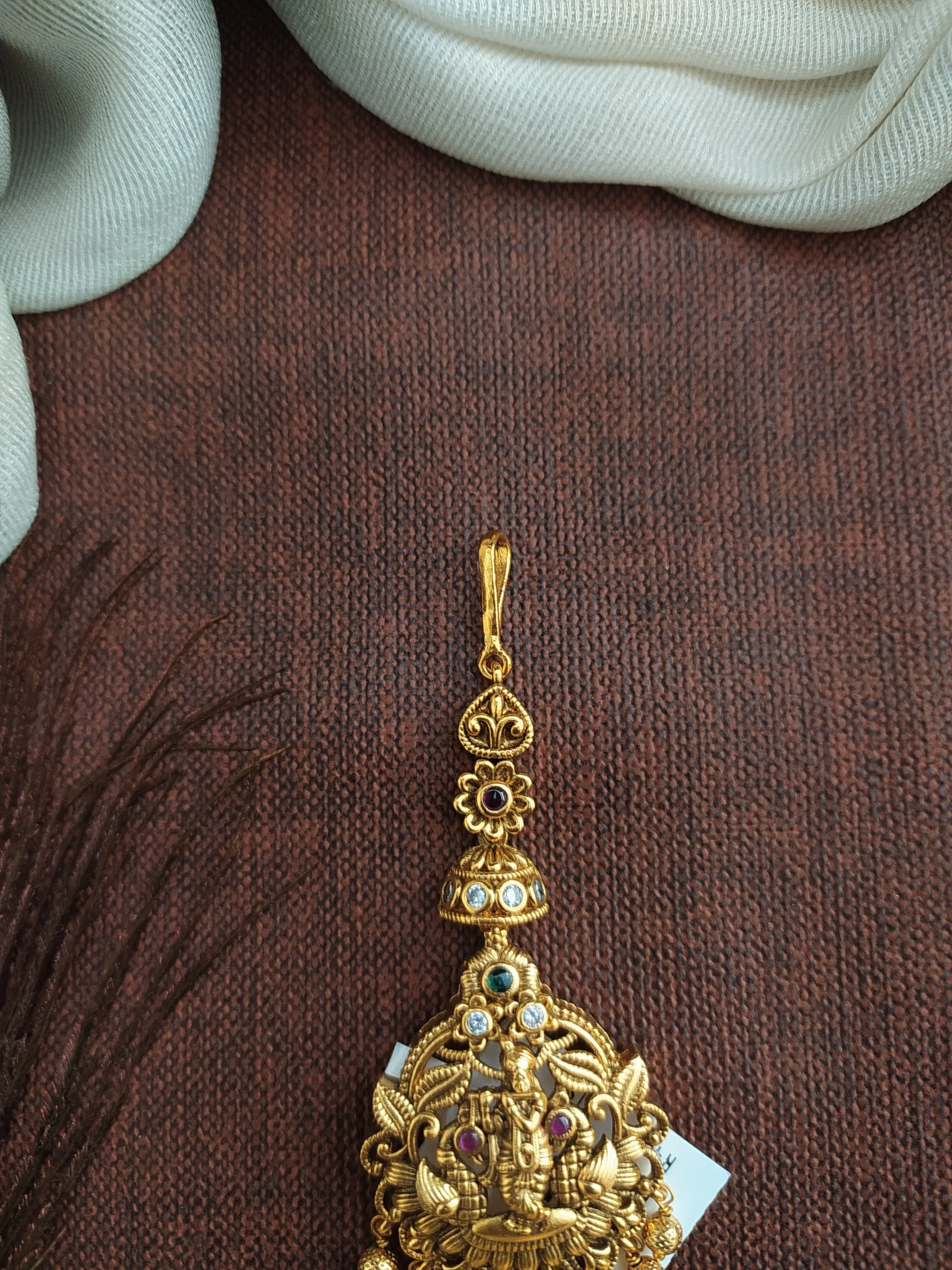 Antique Tikka Featuring Lord Krishna with Kemp and Green Stones