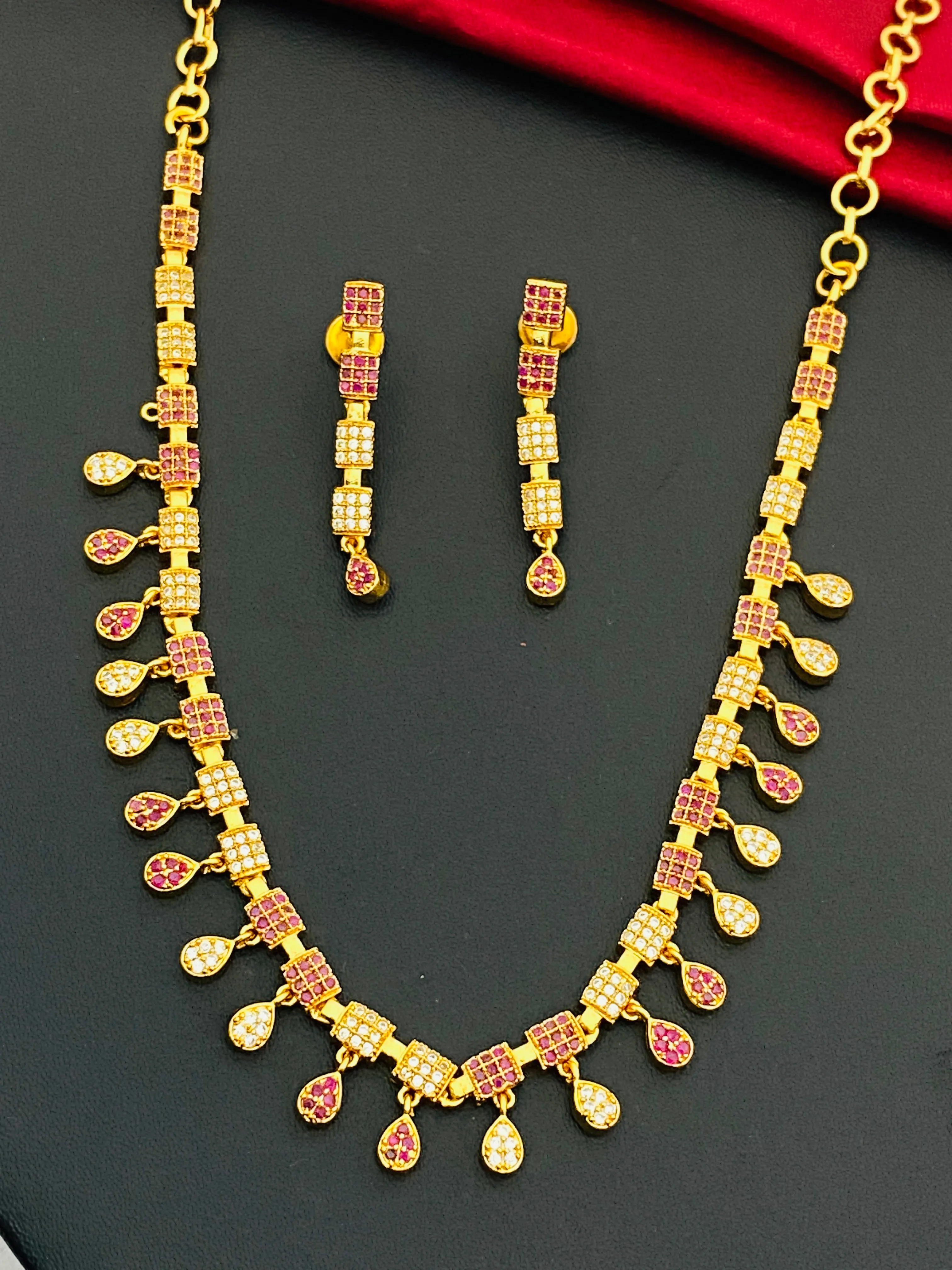 Lovely Gold Plated Ruby And White Colored Necklace With Earrings