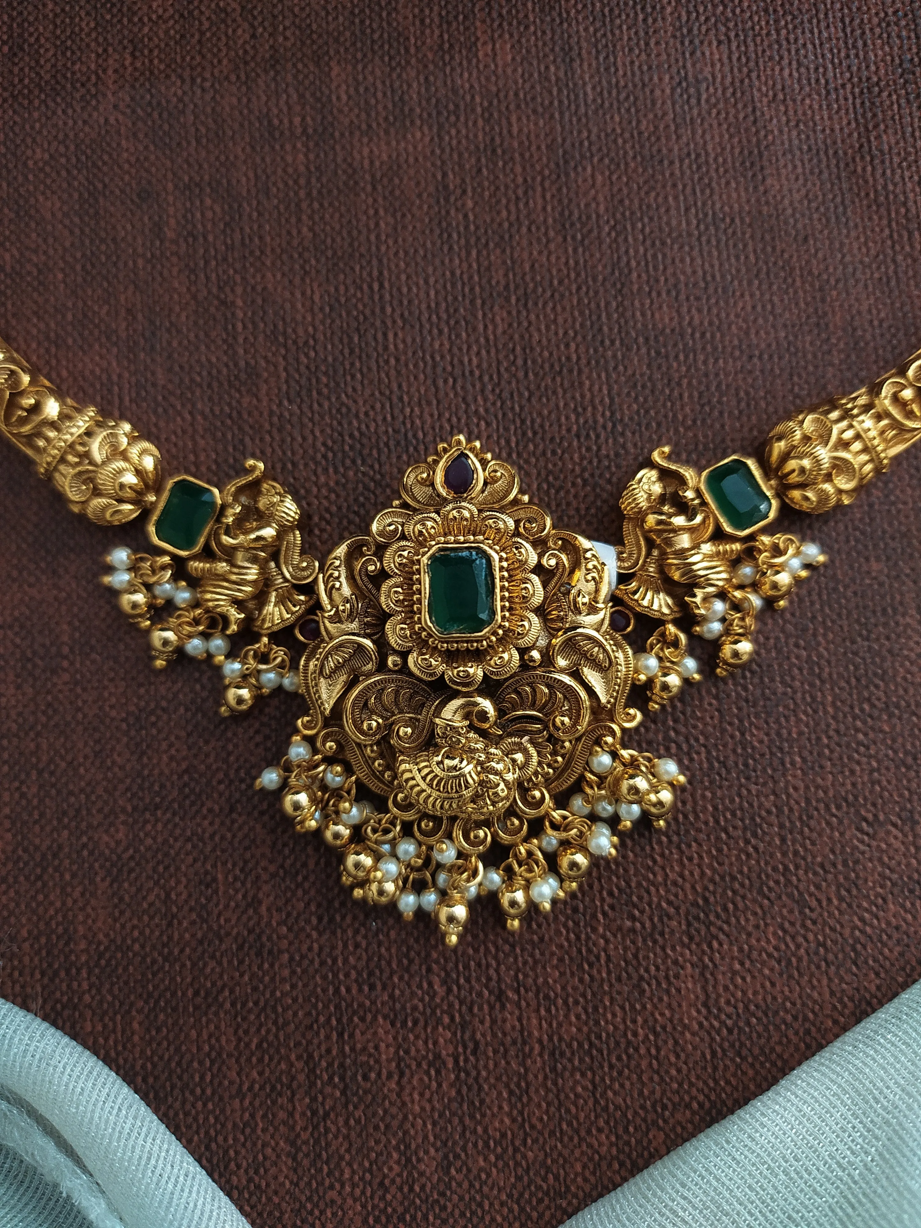 "Antique Kanti (Hasli) Necklace Set with Emerald Stones and Nagas Work"